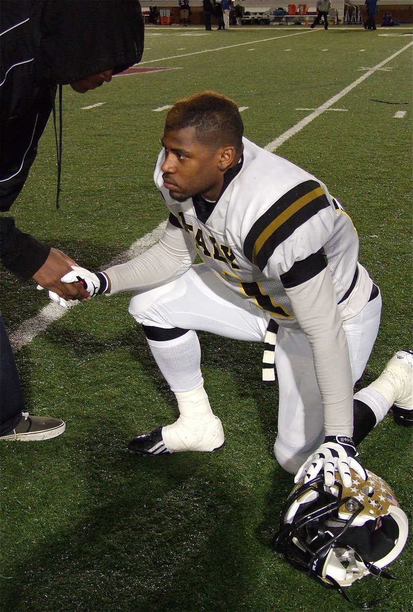 Image: As member of Italy’s 2011 team, Larry Mayberry, Jr. congratulates Jalarnce Lewis(21) on his outstanding senior season.