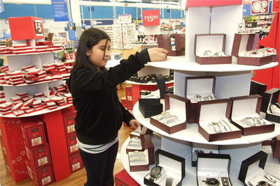 Image: Arley Salazar hits the jackpot in the jewelry section. Can we get a police escort over here for all this bling?