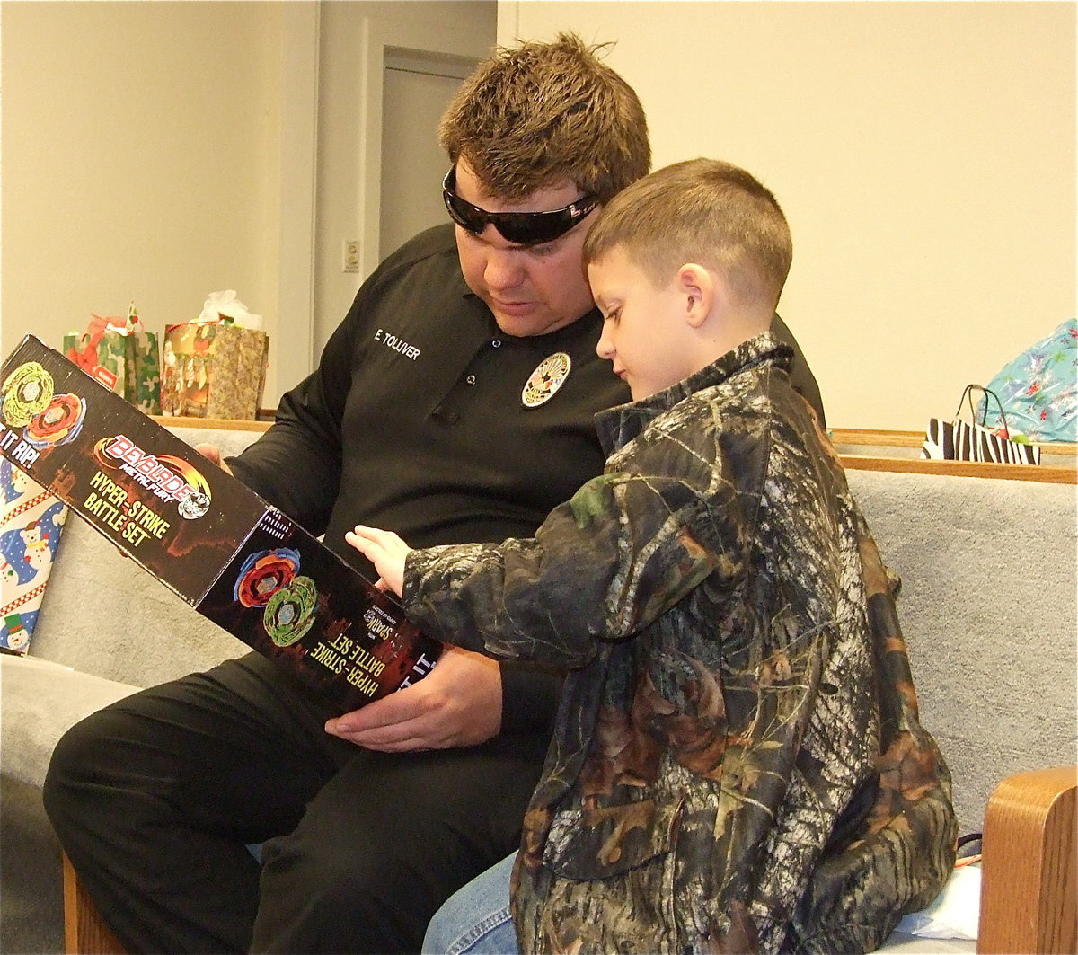 Image: What it’s all about…
    Officer Eric Tolliver gives Chance Shaffer all the attention he needs this Christmas with the Italy Police Department’s “Shop with a Cop” program proving to make a difference for Stafford’s students. Calling all hearts…