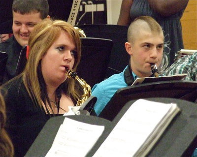 Image: Drum major Emily Stiles and freshman Brandon Connor play their saxophones during the concert.