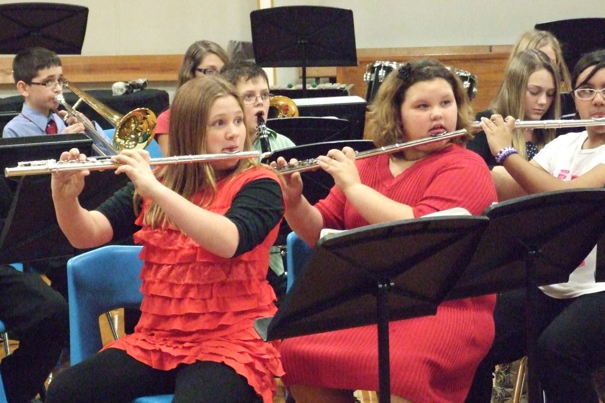 Image: JH Band members Kammie Magness and Virginia Stephens are eagerly awaiting the hand command to make some noise!