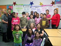 Image: Jeannie Richardson (president of Titus Women), Maxine Morris (vice president of Titus Women) and the Milford fourth grade class.
