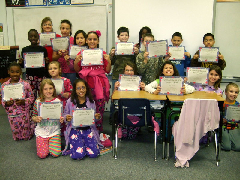 Image: Milford fourth graders showing us their community service awards.