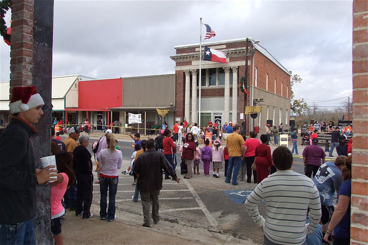 Image: Mason Womack takes in the view from the pavilion entrance as the crowd moves toward Italy City Hall for a live band performance by Smokin-n-Mirrers.