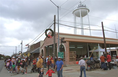 Image: A look at the pavilion with the Italy water tower in the background during the Christmas Festival as everyone gets into position for the parade.