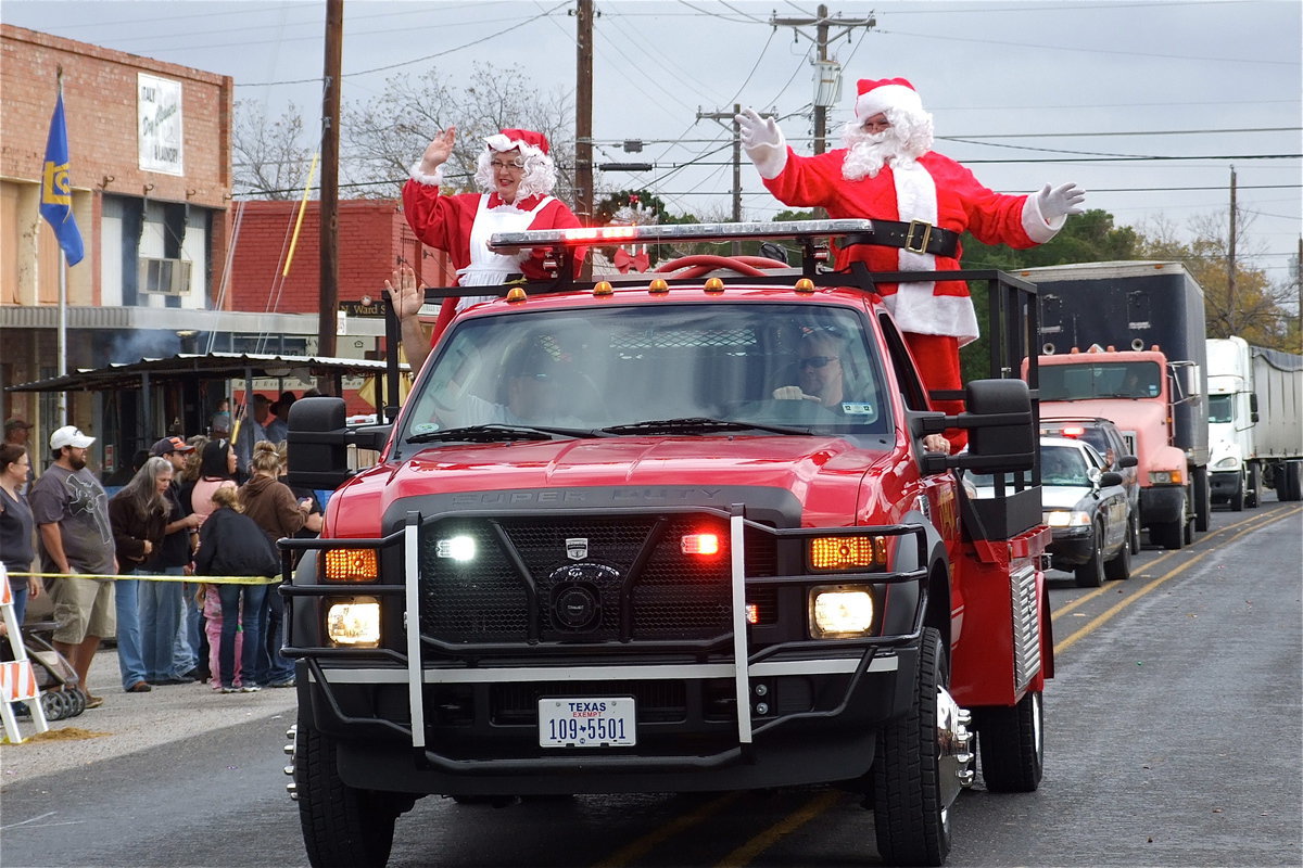 Image: Italy firefighters Jackie Cate and driver Michael Chambers serve as reindeer for Mr. and Mrs. Claus, with Donald and Karen Brummett in costume.