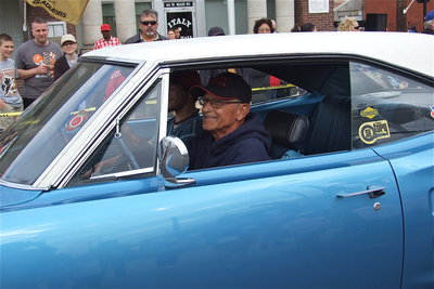 Image: Sal Peralis and his grandson Brandon Jacinto cruise in style during the parade.