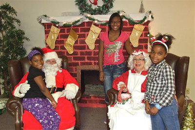 Image: Mr. and Mrs. Clause delivered three beautiful smiles for Christmas.
