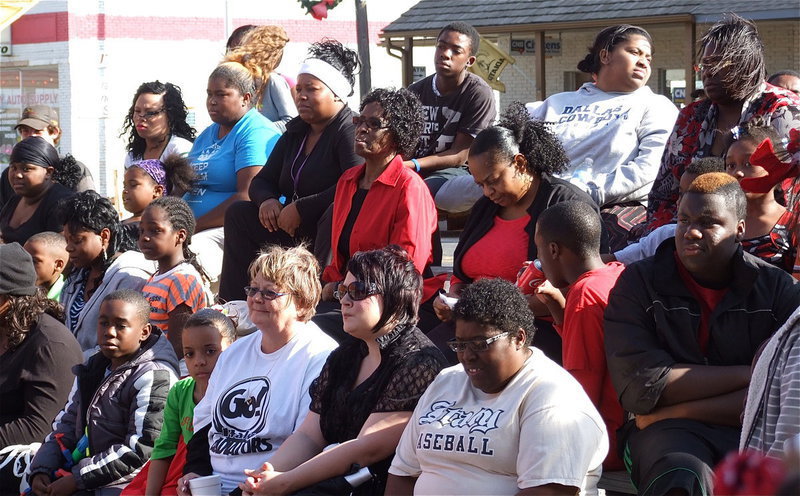 Image: Festival goers enjoy live music and participate during a raffle.