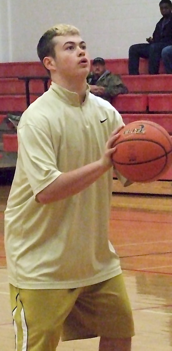 Image: Zain Byers concentrates during pre-game warmups.