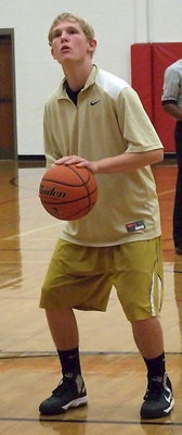 Image: Italy JV Gladiator Cody Boyd practices free-throws before the game against West.