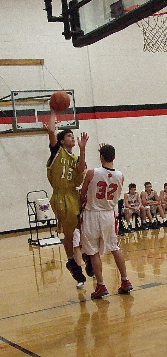 Image: Italy’s Mason Womack(15) drives the baseline.