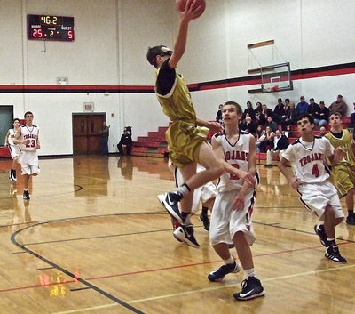 Image: Freshman Ryan Connor(20) puts on his goggles and takes flight against West.