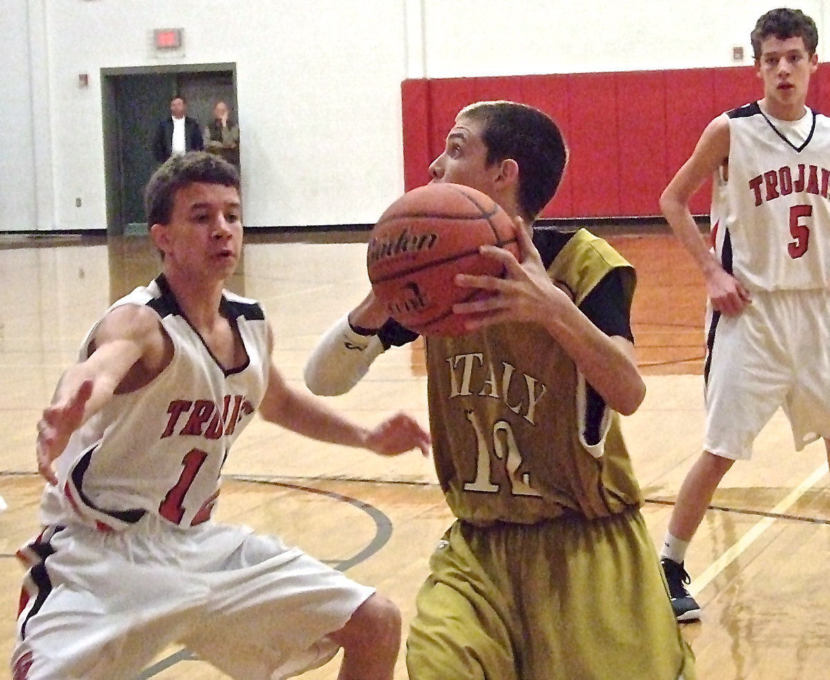 Image: Italy’s Ty Windham(12) pump fakes a West defender.