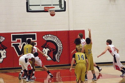 Image: Gladiator Tyler Anderson(11) drops in a free-throw against West.