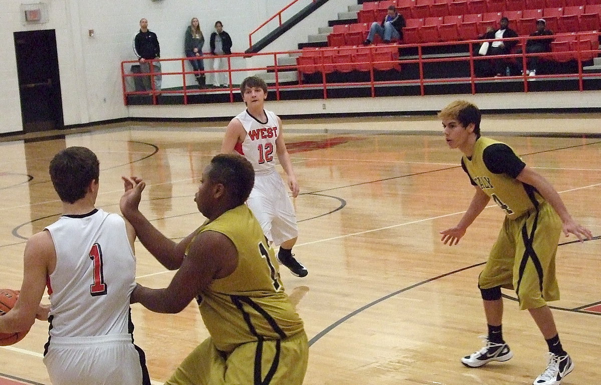 Image: Playing that tough “D” are Gladiators Darol Mayberry(13) and Kelvin Joffre(14).