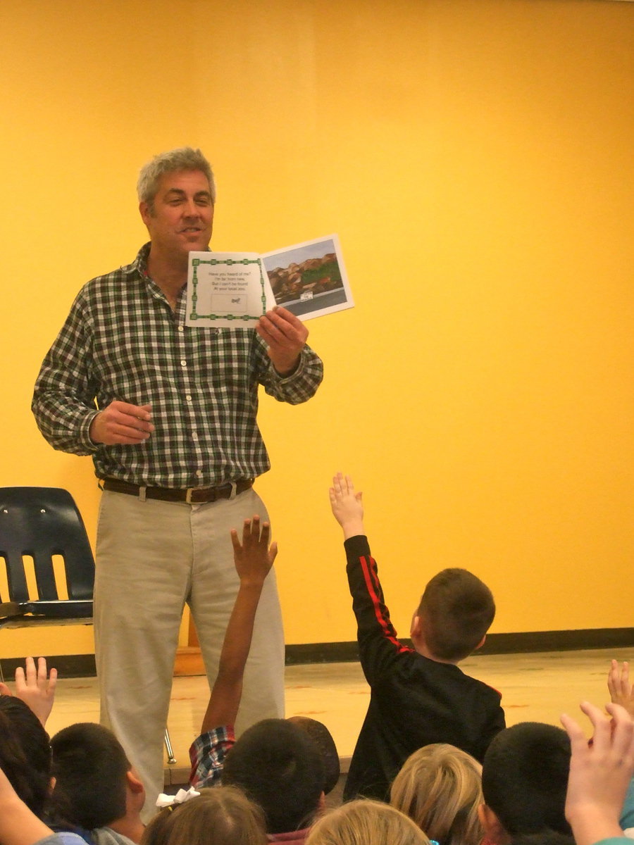 Image: Michael reading his book to and enthusiastic audience.