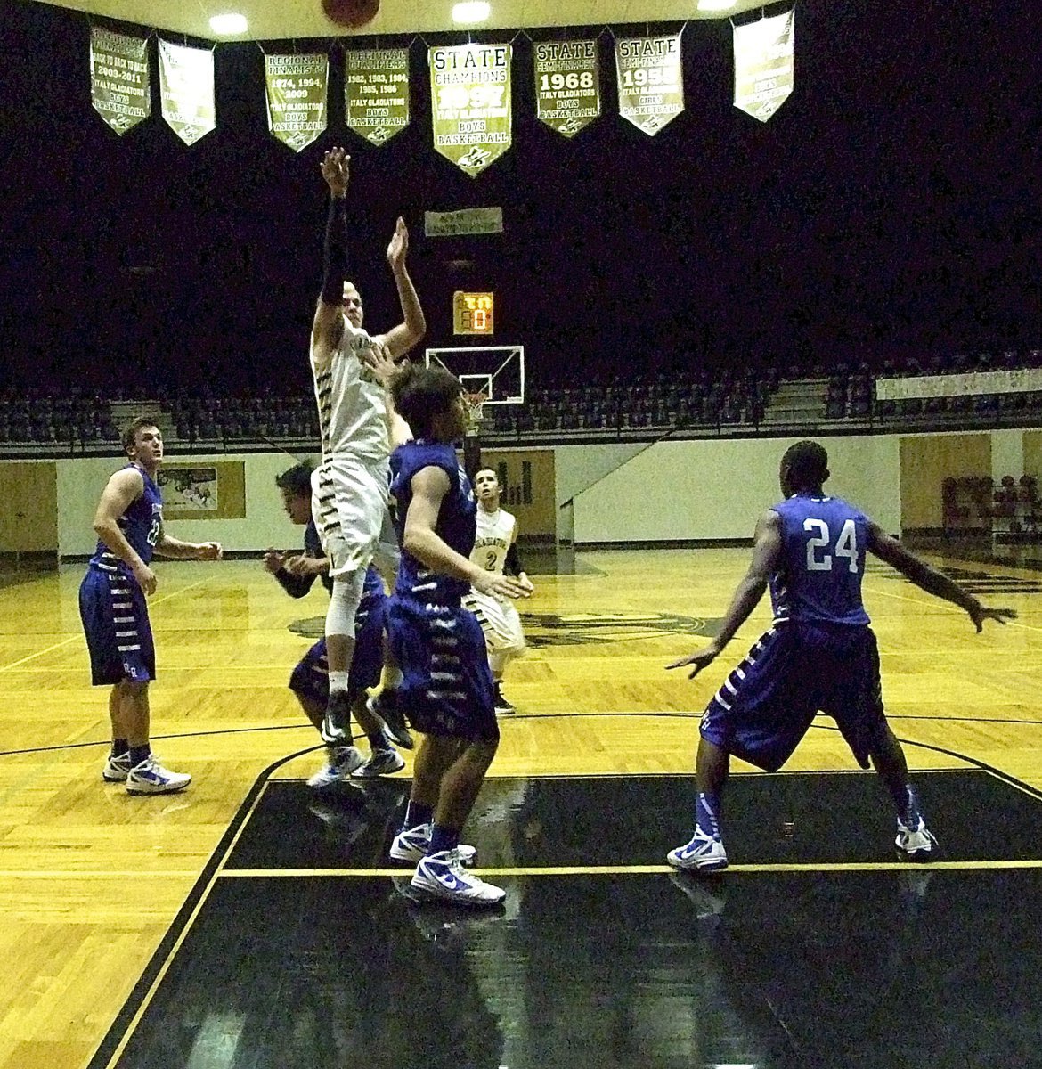 Image: 6’8" Gladiator senior, Cole Hopkins(21), rises for shot attempt over Waco Robinson.