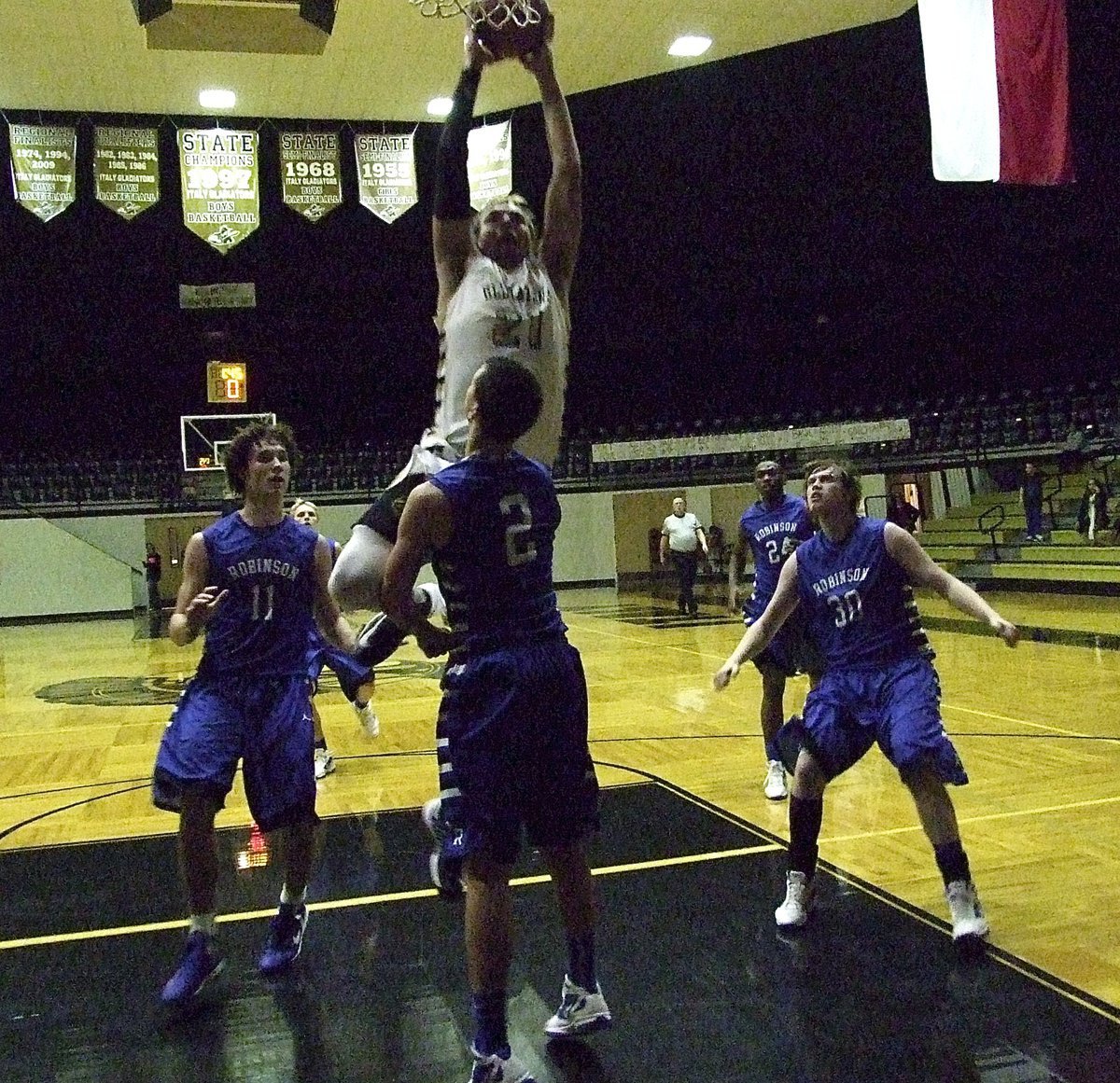 Image: Cole “The Posterizer” Hopkins(21) slam dunks over a Waco Robinson defender.