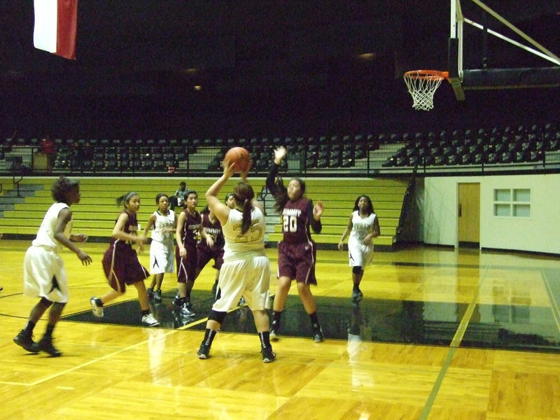 Image: Pass the ball! Monserrat Figuero #25 looks for a teammate.