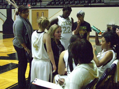 Image: Coach Fullmer explains another play to the Lady Gladiators.