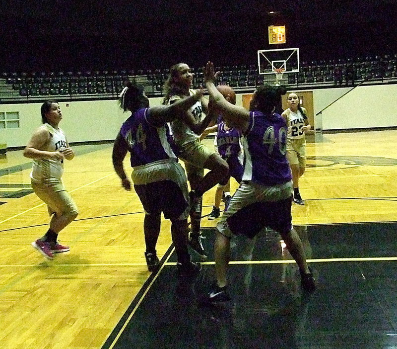 Image: Italy JH’s Emily Cunningham(44) slices into the lane drawing a shooting foul.