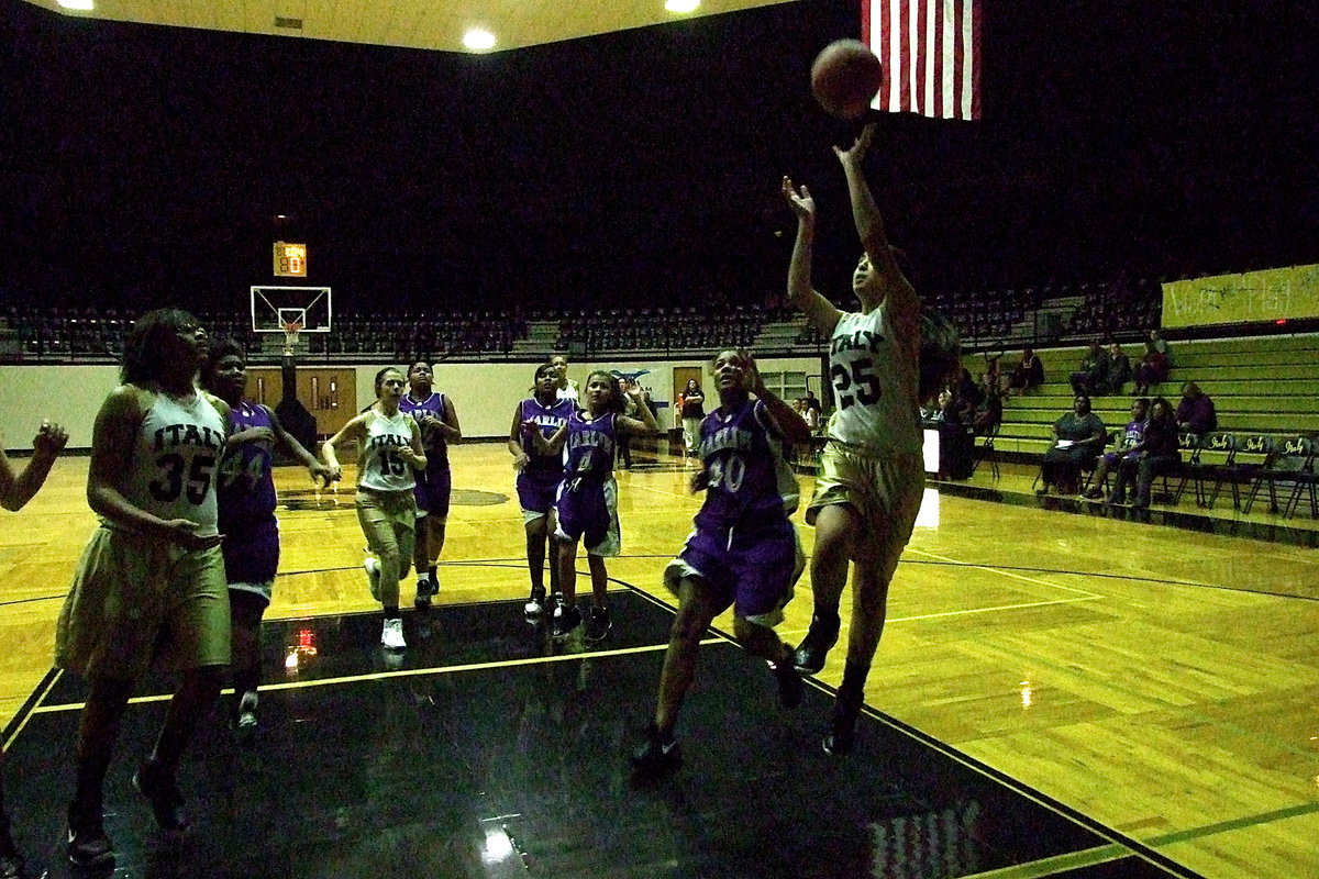 Image: Italy JH’s Elizabeth Garcia(25) drives in for the score.