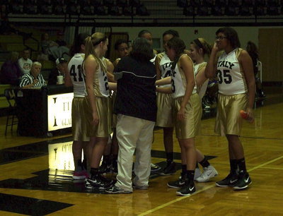 Image: Coach Lindsey Coffman brings her A-Team Lady Gladiators in to the huddle.