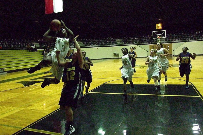 Image: Kortnei Johnson(3) takes flight against the GPAA Lady Eagles on her way to a 32-point outing for the second consecutive game.