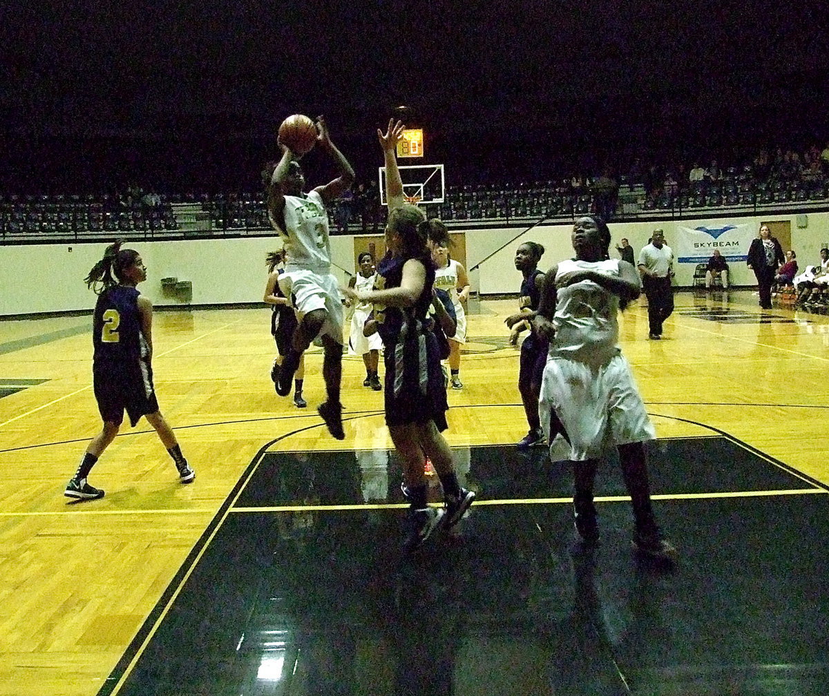 Image: Kortnei Johnson(3) pulls up and knocks down the mini-jumper in the lane with teammate Taleyia Wilson(22) in position to rebound.