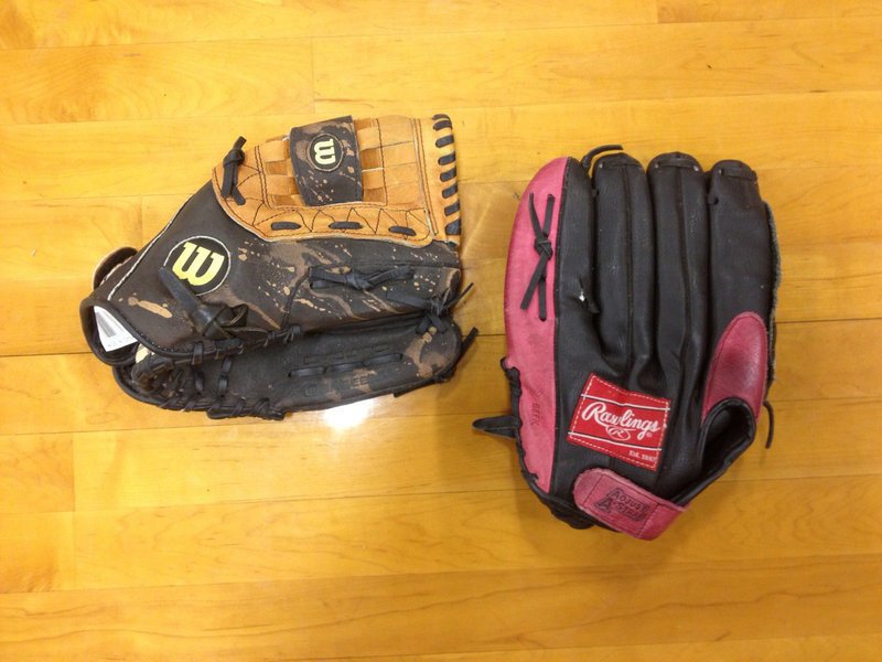 Image: Catch the spirit! Baseball mitts used by the Lady Gladiators over the years. Just look at those stories.