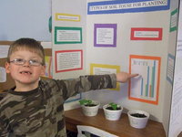 Image: James Berry (2nd grade) took second place for his experiment on types of soil to use for planting.