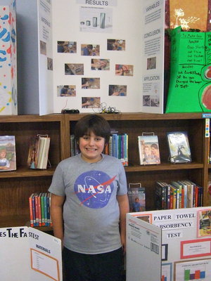 Image: Mike South (6th grade) is very happy that his project placed third.