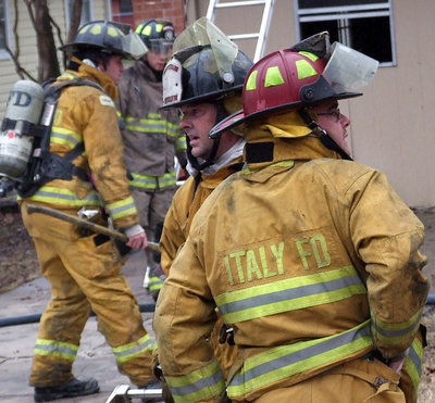 Image: Italy Firefighters Paul Cockerham and Brad Chambers help choreograph the cleanup and investigation.