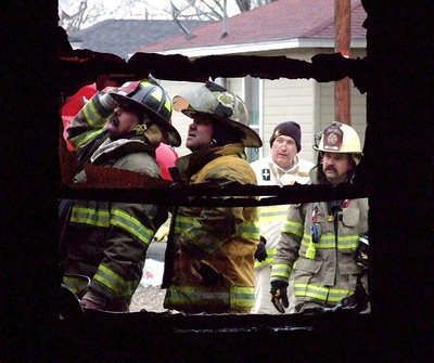 Image: Milford Firefighter Keith Helms and Italy Firefighter Jackie Cate call their chiefs over for another look.