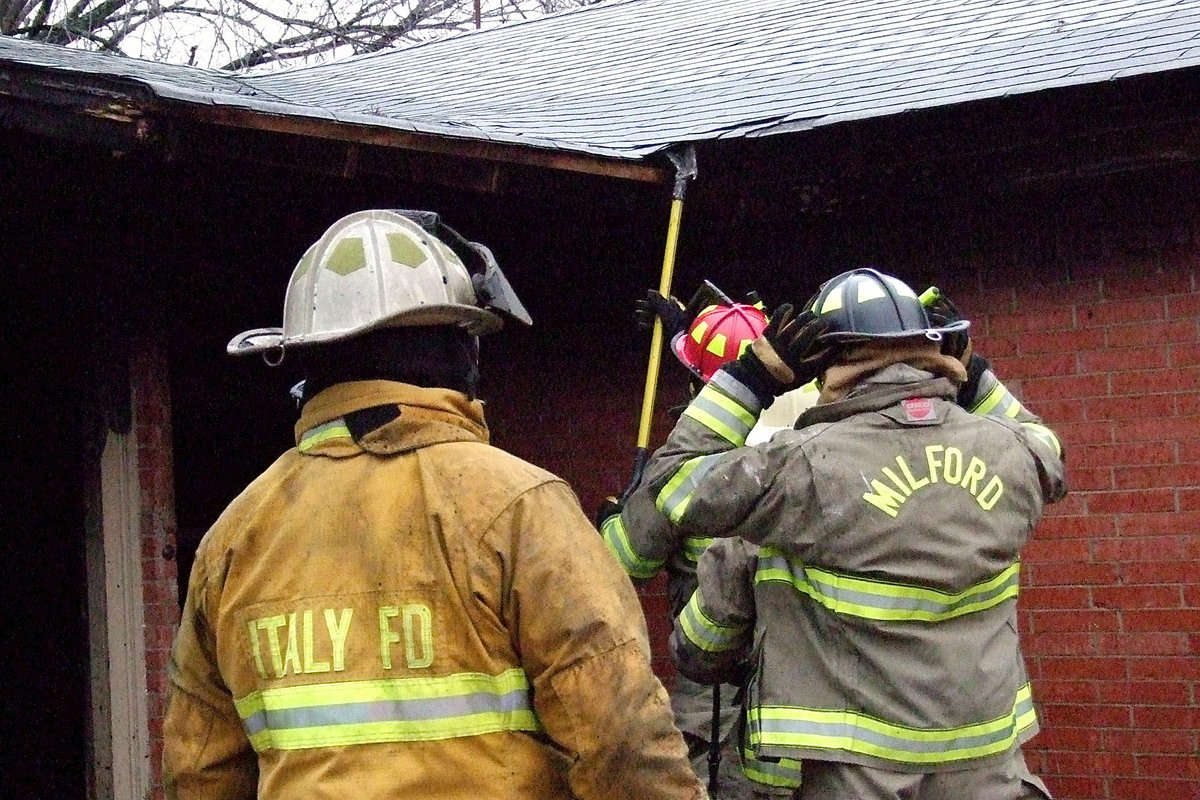 Image: Where is that smoke coming from? Firefighters deal with a potential problem.