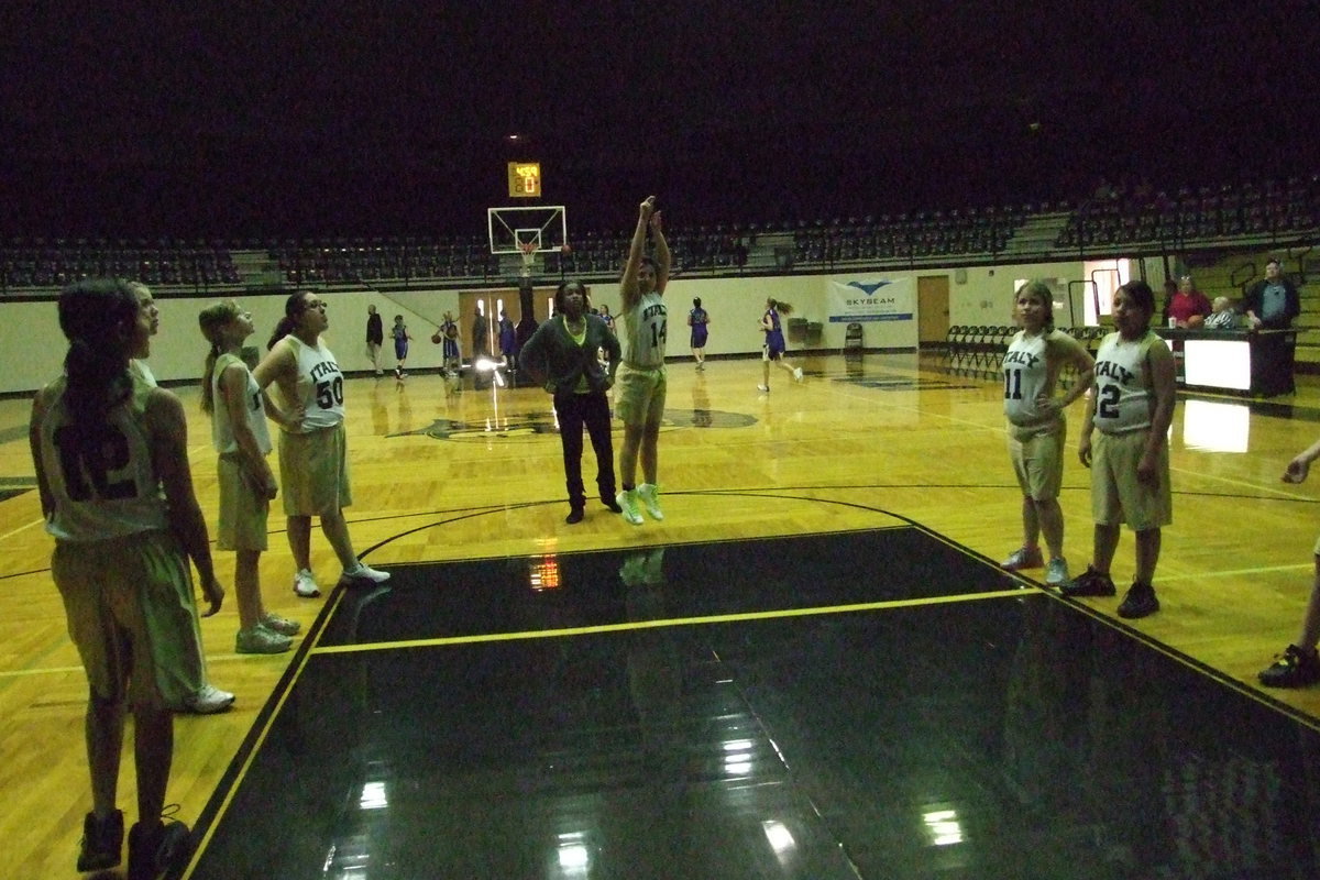 Image: Coach Jessika Robinson observes as Caroline Pittmon(14) and her Italy B-Team JH Lady Gladiator teammates practice free-throws before taking on Blooming Grove.