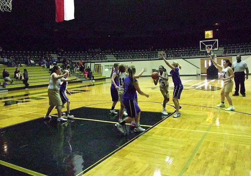 Image: Point guard Sierra Wilson(3) tries to pass to teammate Jill Varner(11).