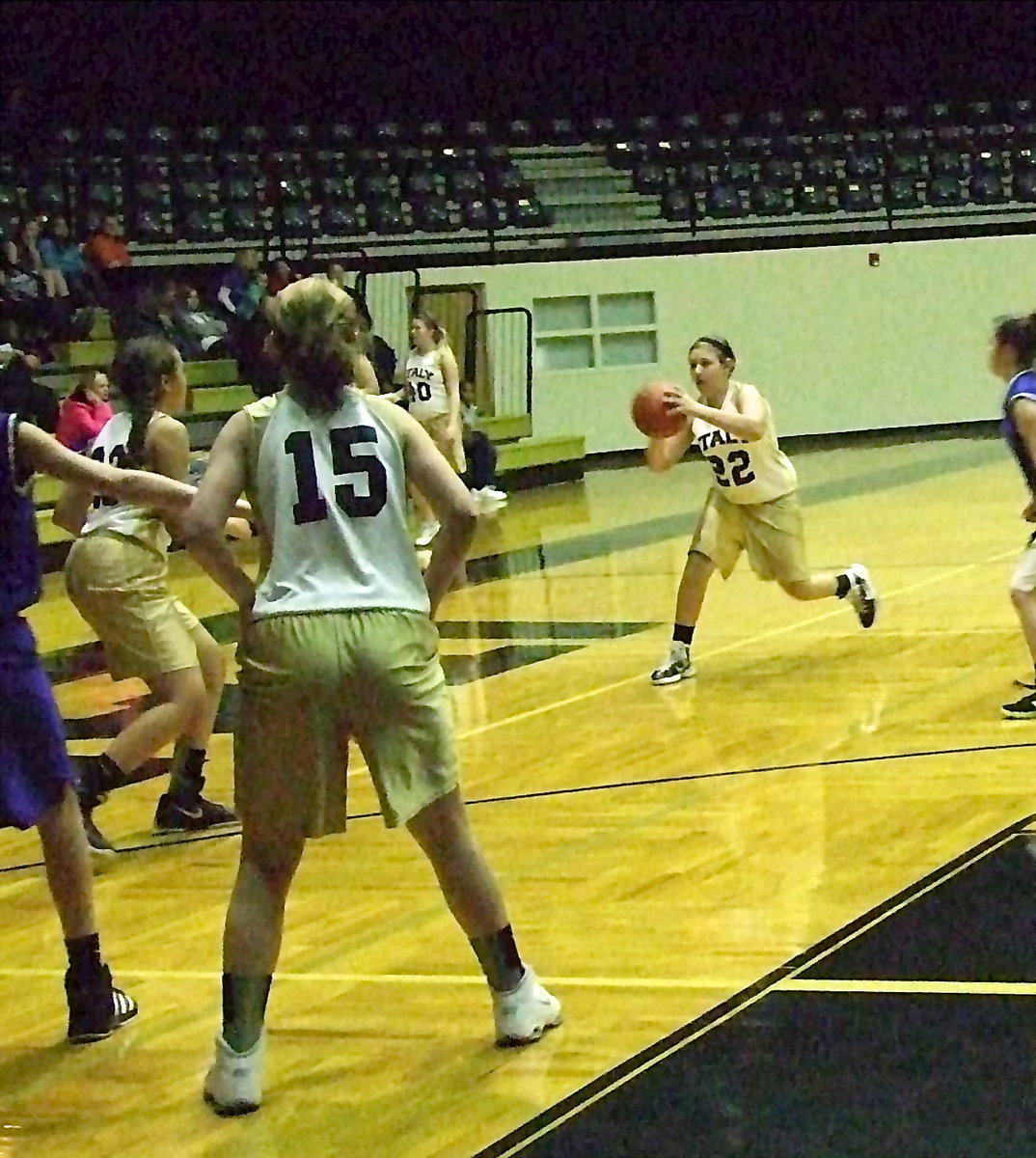 Image: Brycelin Richards(22) passes to Vanessa Cantu(23) as their teammate Brooke De’Borde(15) sets up on the block.