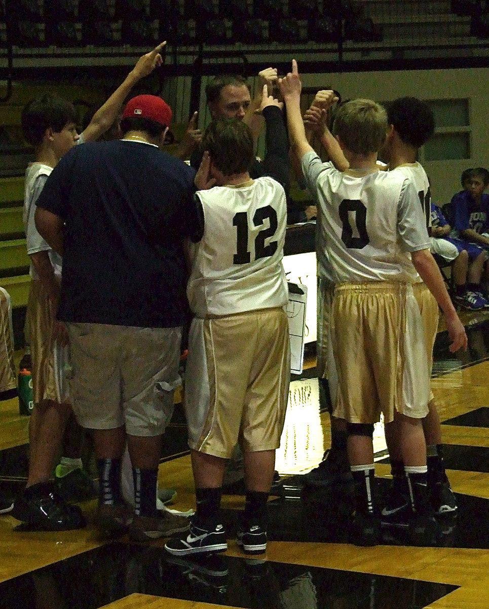 Image: Head coach Josh Ward rallies his 7th grade squad with help from manger Adrian Acevedo.