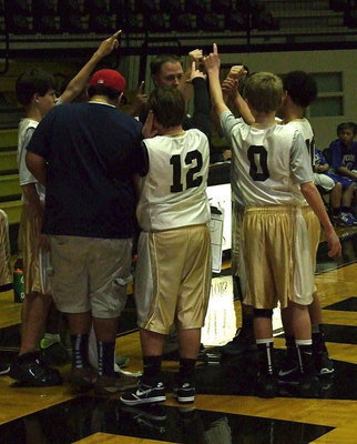 Image: Head coach Josh Ward rallies his 7th grade squad with help from manger Adrian Acevedo.
