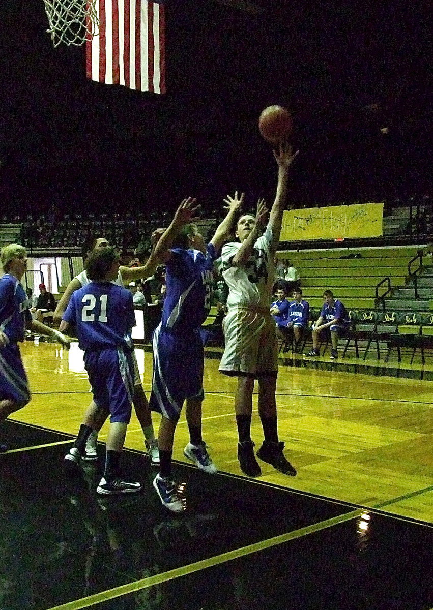 Image: Joshua Cryer(34) scores with a left-handed mini hook shot.