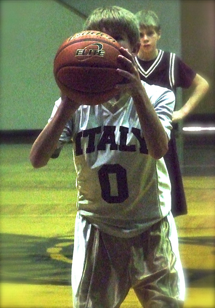 Image: Italy 7th grader Garrett Janek(0) keeps his eye on the target.