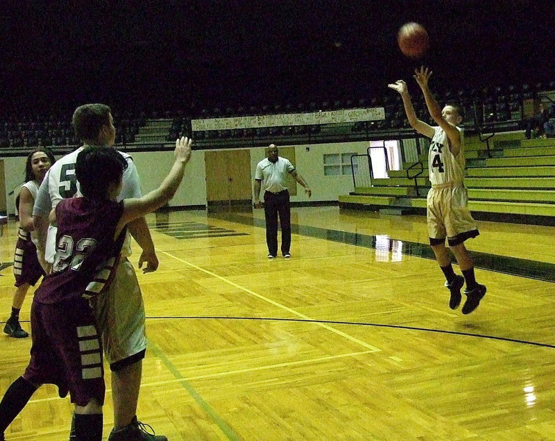 Image: Joshua Cryer(34) from behind the arc as Aaron Pittmon(55) posts up underneath.