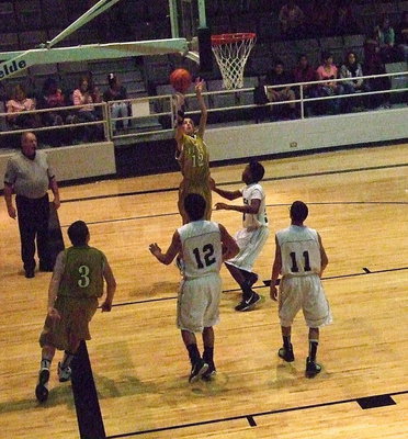 Image: Putting up a baseline jumper is Ty Windham(12).