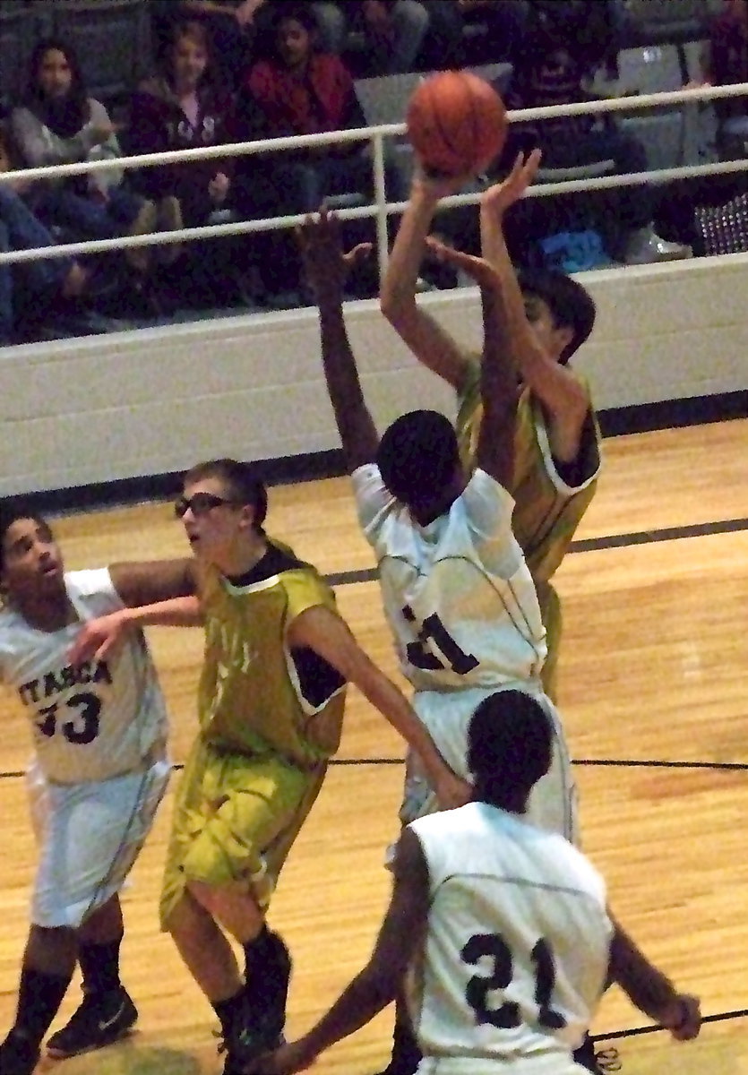 Image: Italy’s Mason Womack(15) pulls up for a jumper in the lane as teammate Brandon Connor(5) fights thru to get into rebounding position.