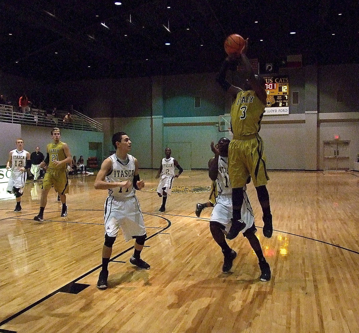 Image: Marvin Cox(3) gets vertical for this jump shot with Italy playing on another level against the Cats.