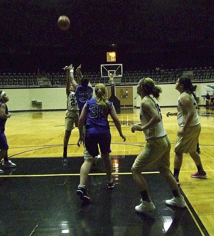 Image: Italy’s A-Team Lady Gladiator Vanessa Cantu(23) release a jump shot over a Lady Lion defender as Brooke DeBorde(15) and Jenna Holden(41) prepare to rebound.