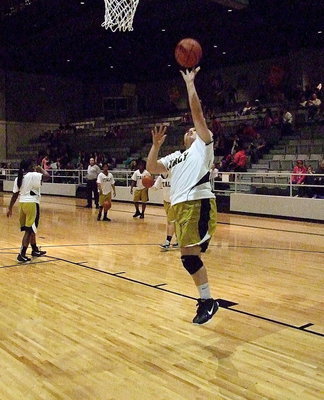 Image: Monserrat Figueroa executes a layup during the pre-game warmups.