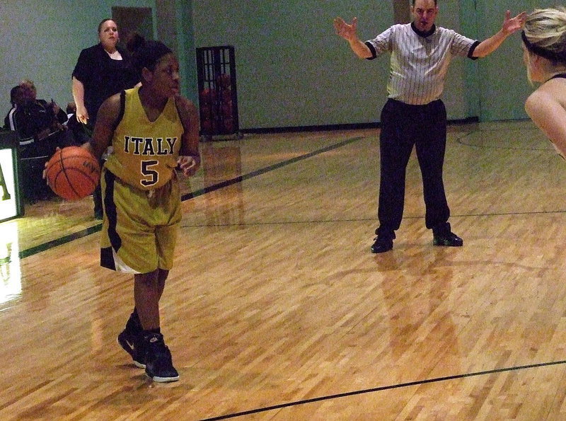 Image: Point guard Jameka Copeland(5) executes a set play for the Lady Gladiators.